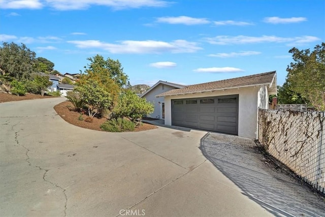 4180 Mount Baldy Ct, Norco, CA 92860 - view of front facade featuring stucco siding, a garage, and fence