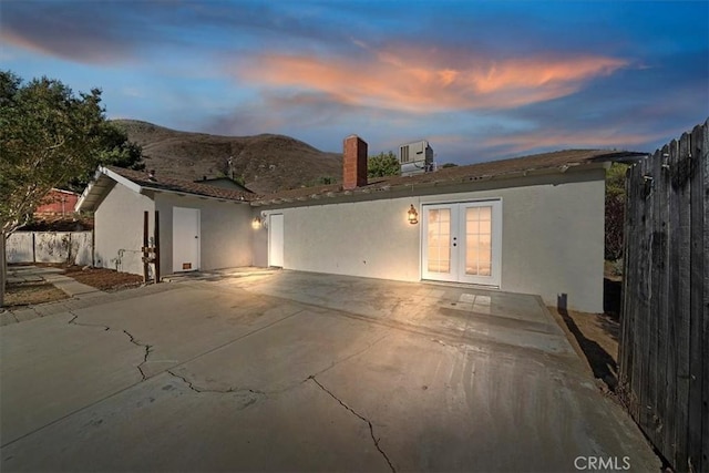 4180 Mount Baldy Ct, Norco, CA 92860 - back of house with french doors, a patio area, fence, and central air condition unit