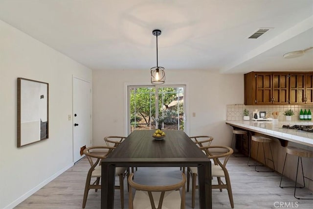 4180 Mount Baldy Ct, Norco, CA 92860 - dining room with light wood-type flooring and baseboards