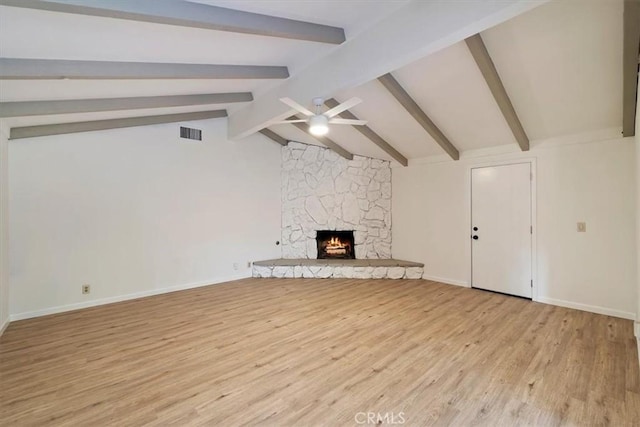 4180 Mount Baldy Ct, Norco, CA 92860 - unfurnished living room with a ceiling fan, light wood-type flooring, a stone fireplace, and baseboards