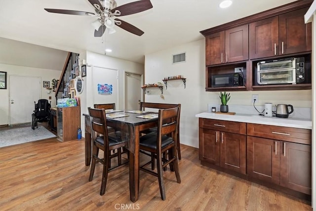 dining space featuring light wood-style flooring, ceiling fan, and recessed lighting