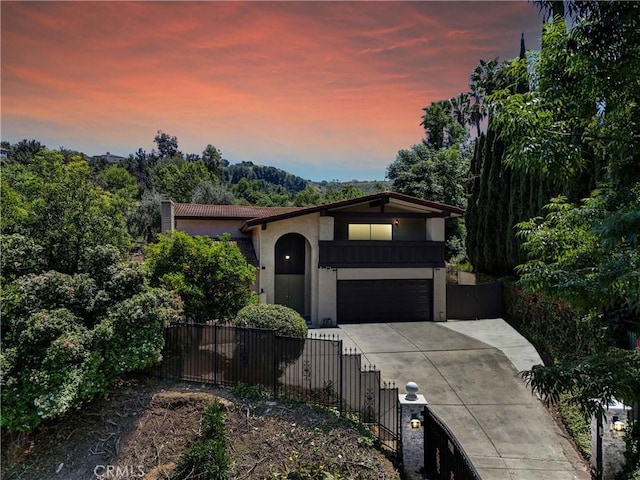 1467 S Montezuma Way, West Covina, CA 91791 - mediterranean / spanish home with stucco siding, driveway, an attached garage, and a tile roof