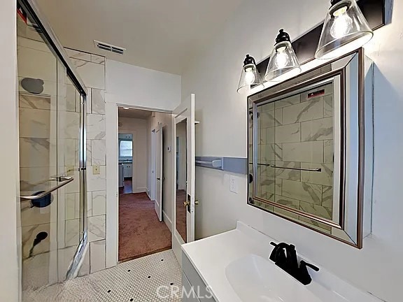 4890 7th Ave, Sacramento, CA 95820 - bathroom with a stall shower and vanity
