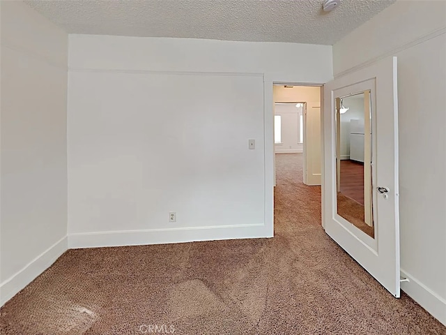 4890 7th Ave, Sacramento, CA 95820 - carpeted spare room featuring baseboards and a textured ceiling