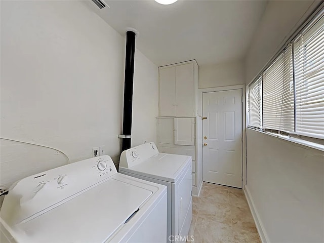 4890 7th Ave, Sacramento, CA 95820 - clothes washing area with washer and dryer and baseboards