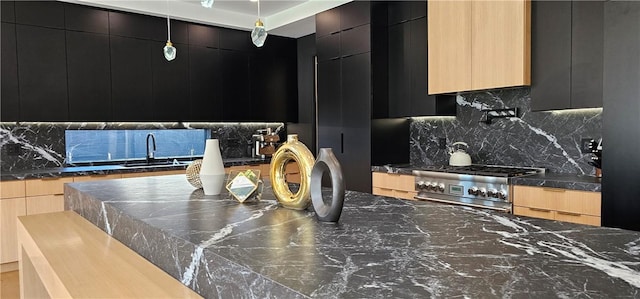 5141 Varna Ave, Sherman Oaks, CA 91423 - kitchen featuring modern cabinets, a sink, and dark cabinets