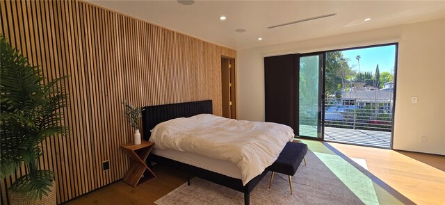 5141 Varna Ave, Sherman Oaks, CA 91423 - bedroom with access to exterior, recessed lighting, wood finished floors, and wooden walls