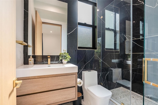 5141 Varna Ave, Sherman Oaks, CA 91423 - bathroom featuring tile walls, a marble finish shower, toilet, vanity, and decorative backsplash