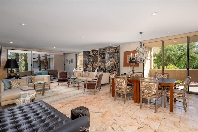living area with a chandelier, light marble finish floors, and recessed lighting