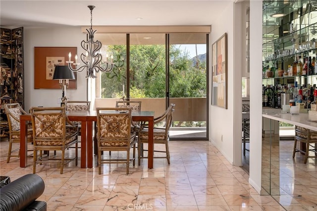 dining space with a chandelier and light marble finish flooring