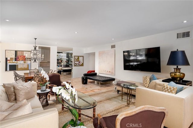 living area featuring a chandelier and recessed lighting