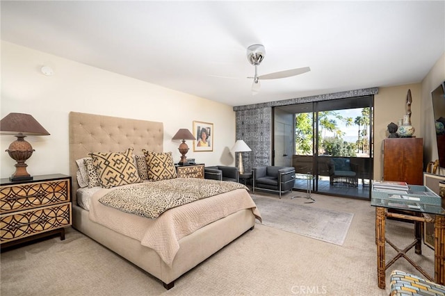 carpeted bedroom with access to exterior and ceiling fan