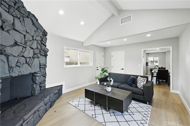 10641 Lindale St, Norwalk, CA 90650 - living room with beamed ceiling, light wood finished floors, recessed lighting, baseboards, and a fireplace