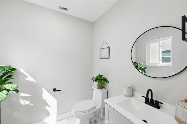 10641 Lindale St, Norwalk, CA 90650 - half bathroom featuring toilet, vanity, and marble finish floors