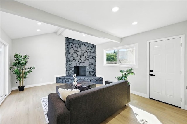 10641 Lindale St, Norwalk, CA 90650 - living room featuring light wood-style flooring, a stone fireplace, baseboards, and recessed lighting