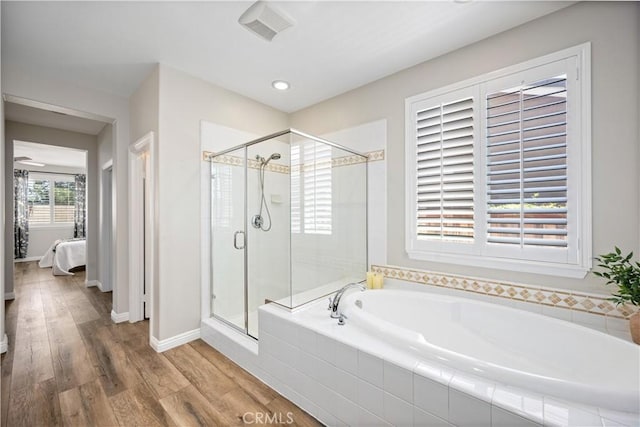 28264 Spring Creek Way, Menifee, CA 92585 - ensuite bathroom featuring a bath, a shower stall, wood finished floors, recessed lighting, and baseboards