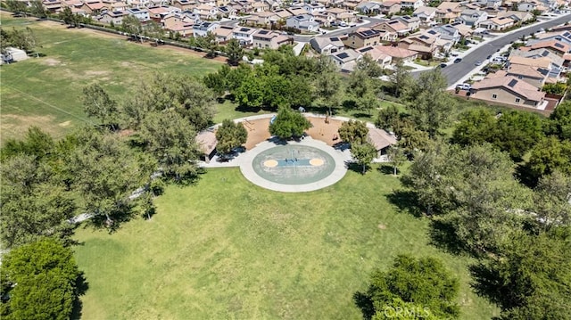 aerial view of property and surrounding area with nearby suburban area