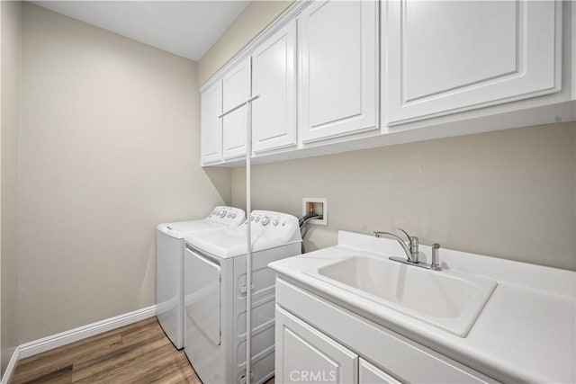 28264 Spring Creek Way, Menifee, CA 92585 - washroom with cabinet space, baseboards, washing machine and dryer, and wood finished floors