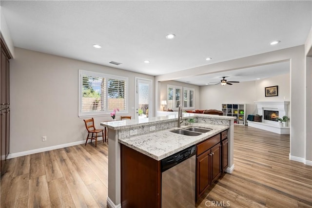 28264 Spring Creek Way, Menifee, CA 92585 - kitchen with dishwasher, a sink, light wood finished floors, open floor plan, and a ceiling fan