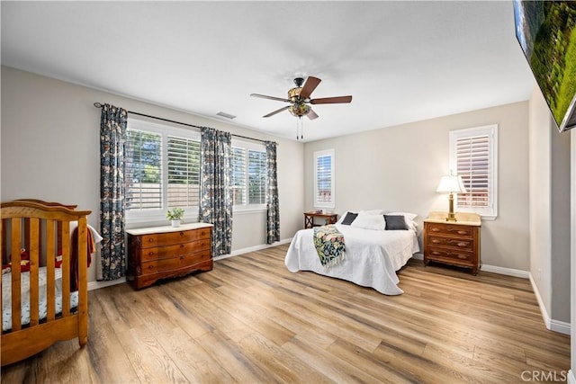 28264 Spring Creek Way, Menifee, CA 92585 - bedroom featuring light wood finished floors, baseboards, and a ceiling fan