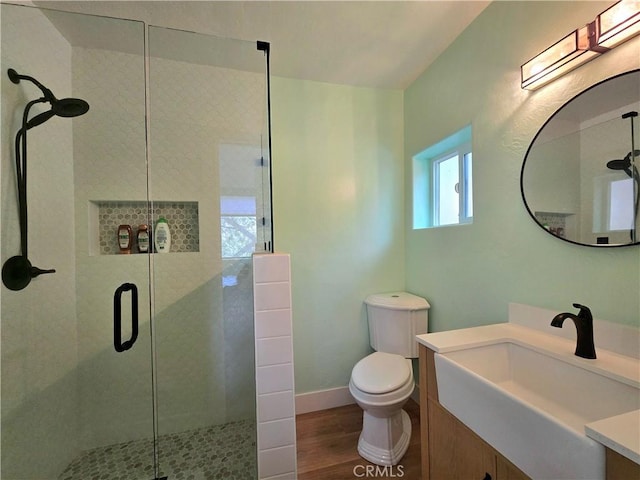 27403 Cottonwood Ln, Lake Arrowhead, CA 92317 - bathroom featuring a shower stall, toilet, wood finished floors, and vanity