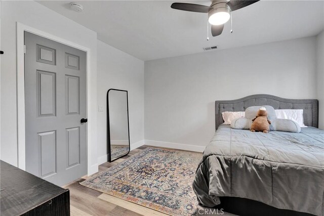 2612 Chauncy Pl, Riverside, CA 92506 - bedroom featuring baseboards, wood finished floors, and ceiling fan