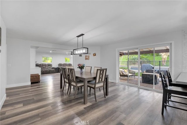 2612 Chauncy Pl, Riverside, CA 92506 - dining area featuring wood finished floors, plenty of natural light, baseboards, and a chandelier