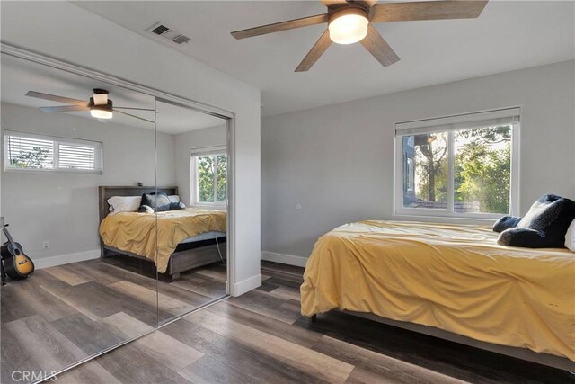 2612 Chauncy Pl, Riverside, CA 92506 - bedroom featuring multiple windows, wood finished floors, and baseboards