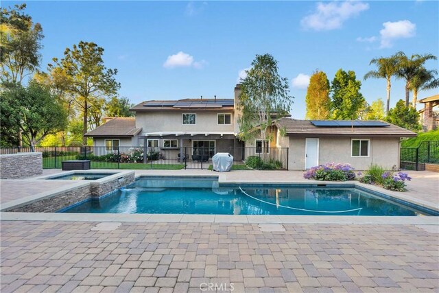 2612 Chauncy Pl, Riverside, CA 92506 - view of pool with fence, a patio area, and a pool with connected hot tub