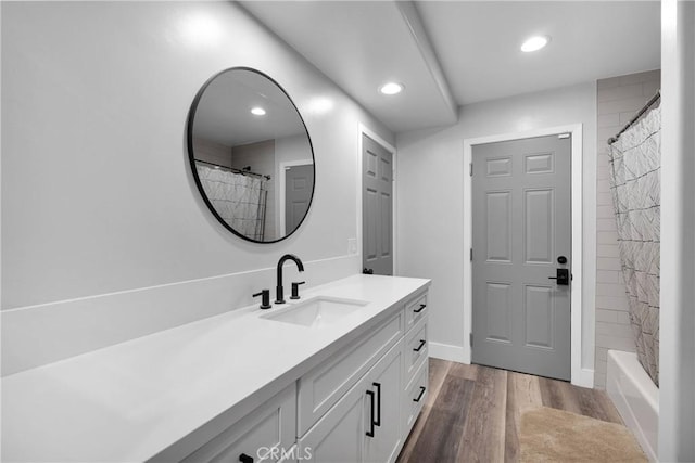 2612 Chauncy Pl, Riverside, CA 92506 - full bath with wood finished floors, vanity, a shower with shower curtain, recessed lighting, and baseboards