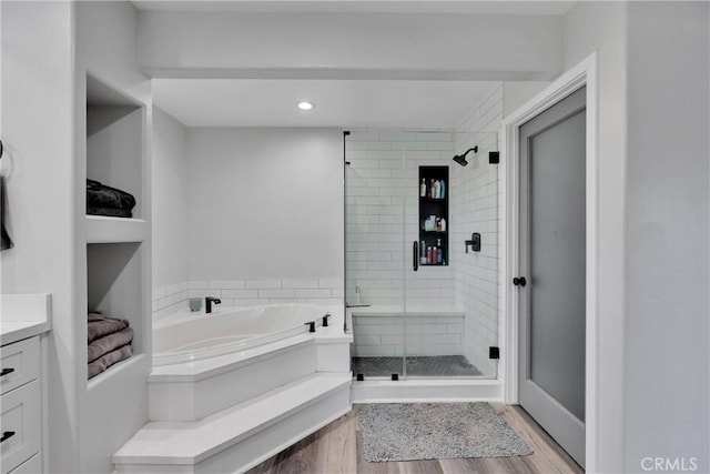 2612 Chauncy Pl, Riverside, CA 92506 - bathroom with a shower stall, a garden tub, wood finished floors, and vanity