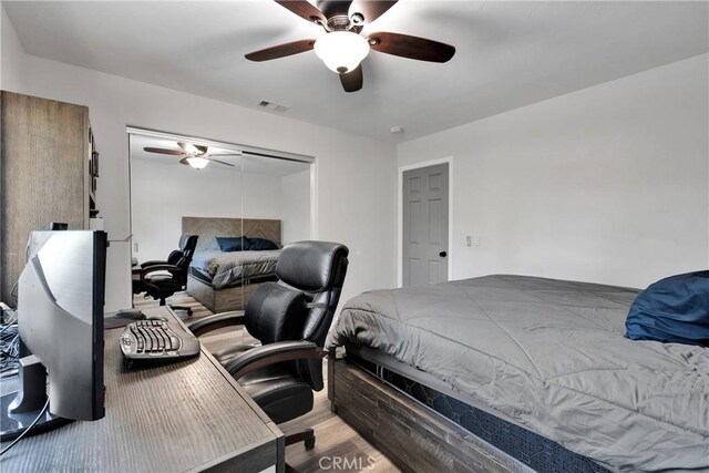 2612 Chauncy Pl, Riverside, CA 92506 - bedroom featuring a closet, wood finished floors, and a ceiling fan
