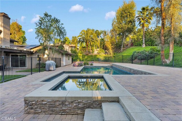 2612 Chauncy Pl, Riverside, CA 92506 - view of pool featuring an in-ground hot tub, a fenced backyard, and a patio