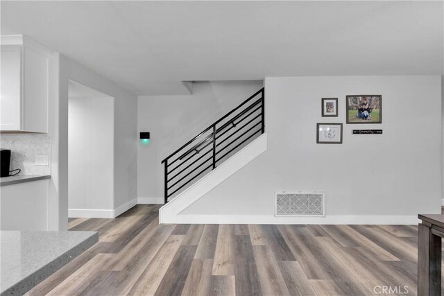 2612 Chauncy Pl, Riverside, CA 92506 - staircase featuring wood finished floors and baseboards