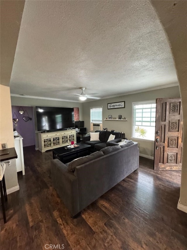 6045 Harding Ave, South Gate, CA 90280 - living area featuring ceiling fan, a textured ceiling, plenty of natural light, dark wood-style flooring, and baseboards