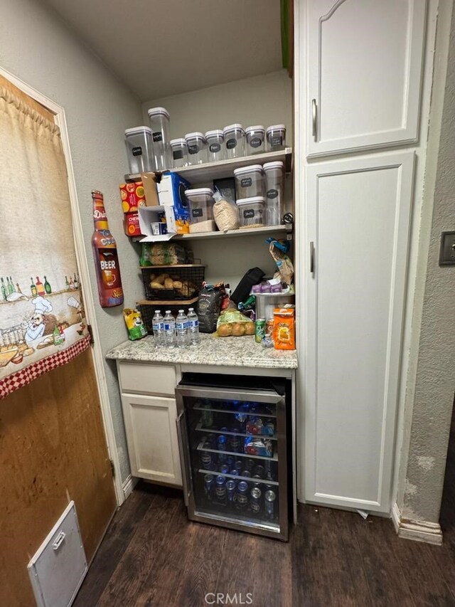 6045 Harding Ave, South Gate, CA 90280 - indoor dry bar featuring wine cooler, dark wood-style flooring, and baseboards