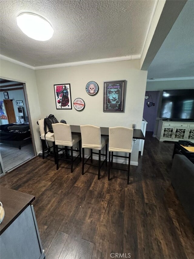 6045 Harding Ave, South Gate, CA 90280 - dining room featuring wood finished floors and a textured ceiling