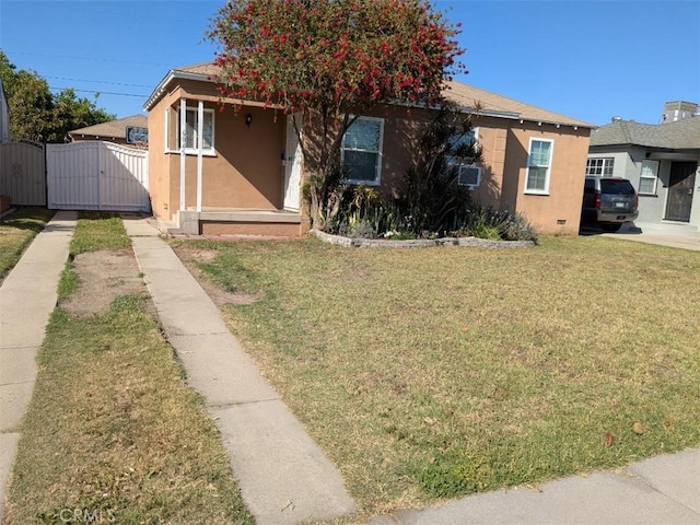 6045 Harding Ave, South Gate, CA 90280 - view of front facade with a gate and stucco siding