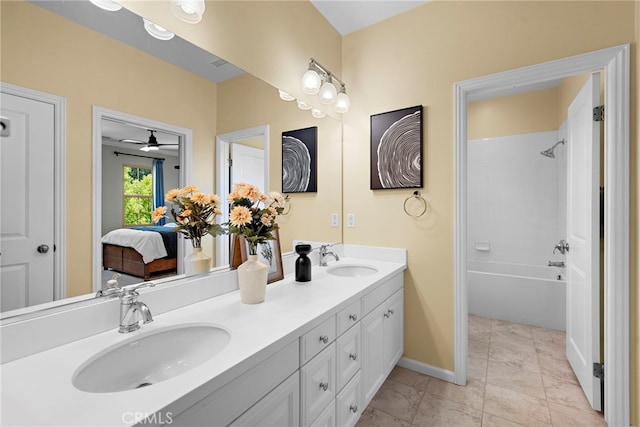 21 Fanpalm, Irvine, CA 92620 - ensuite bathroom featuring double vanity, ceiling fan, baseboards, and shower / tub combination