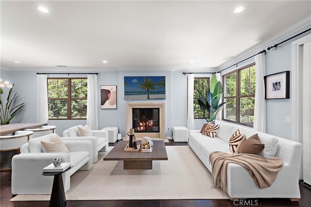21 Fanpalm, Irvine, CA 92620 - living room with ornamental molding, healthy amount of natural light, recessed lighting, a glass covered fireplace, and wood finished floors