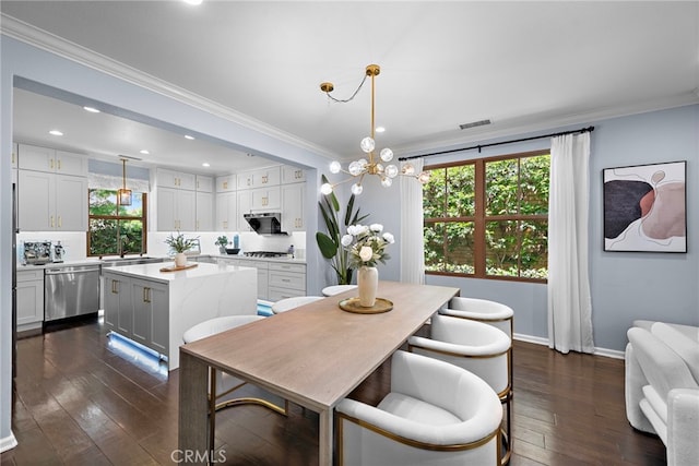 21 Fanpalm, Irvine, CA 92620 - dining room with plenty of natural light, crown molding, dark wood-type flooring, recessed lighting, and baseboards