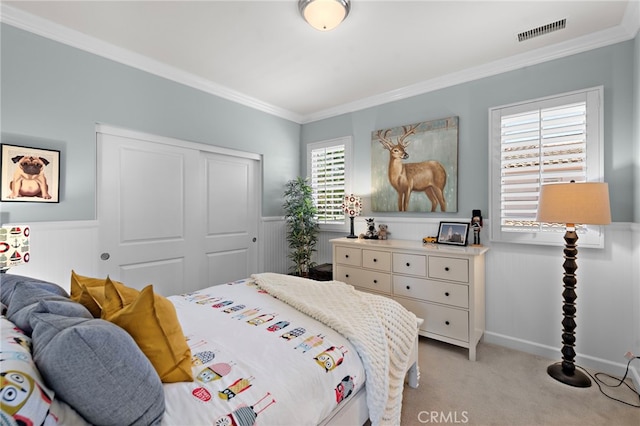 21 Fanpalm, Irvine, CA 92620 - bedroom featuring light carpet, crown molding, a closet, and a wainscoted wall