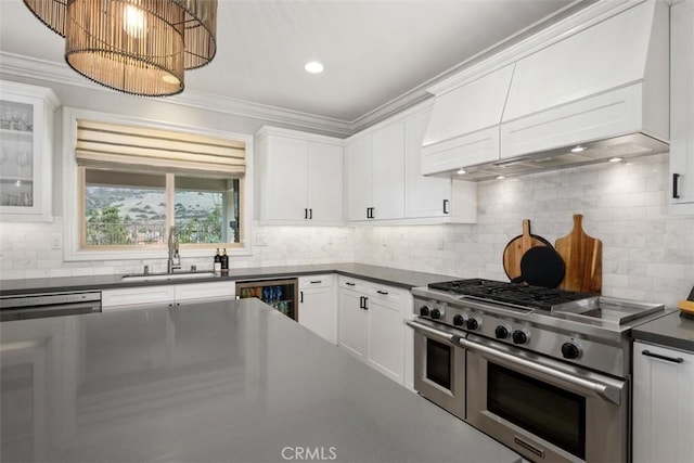 31740 Via Pamplona, San Juan Capistrano, CA 92675 - kitchen featuring appliances with stainless steel finishes, a sink, wine cooler, dark countertops, and white cabinetry