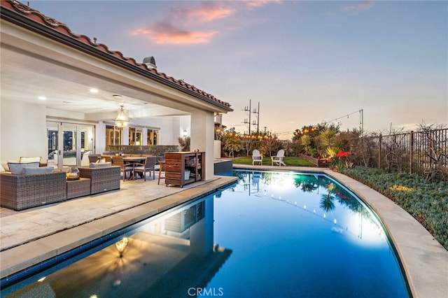 31740 Via Pamplona, San Juan Capistrano, CA 92675 - outdoor pool featuring an outdoor hangout area, french doors, fence, and a patio area