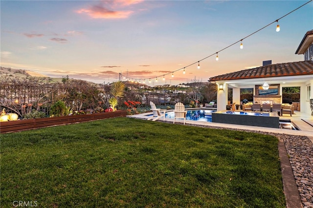 31740 Via Pamplona, San Juan Capistrano, CA 92675 - yard at dusk featuring an outdoor living space and a patio area