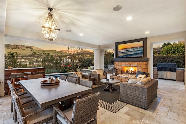 31740 Via Pamplona, San Juan Capistrano, CA 92675 - view of patio / terrace featuring grilling area, an outdoor living space with a fireplace, an outdoor kitchen, and outdoor dining area