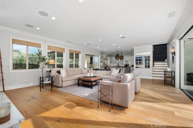31740 Via Pamplona, San Juan Capistrano, CA 92675 - living area with crown molding, light wood-style flooring, baseboards, stairway, and recessed lighting