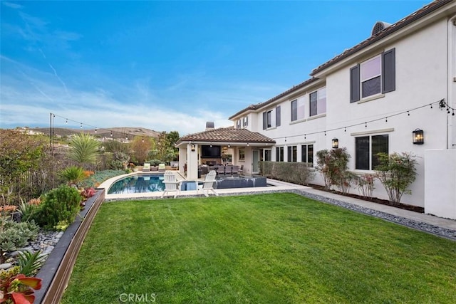 31740 Via Pamplona, San Juan Capistrano, CA 92675 - back of house featuring a lawn, a patio area, and stucco siding