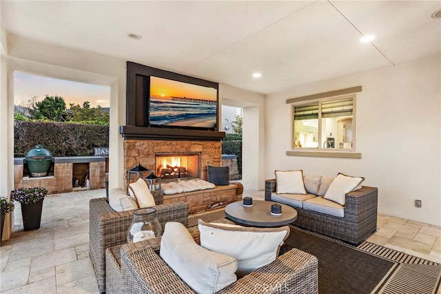 31740 Via Pamplona, San Juan Capistrano, CA 92675 - living area with stone tile floors, an outdoor stone fireplace, and recessed lighting