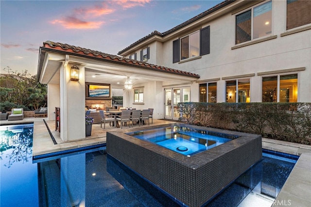31740 Via Pamplona, San Juan Capistrano, CA 92675 - outdoor pool with an in-ground hot tub, a patio area, outdoor dining space, and an outdoor living space